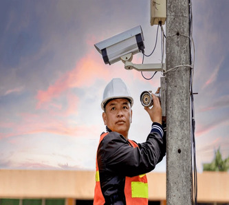 cctv installer installing security camera 600nw 1984531442 1